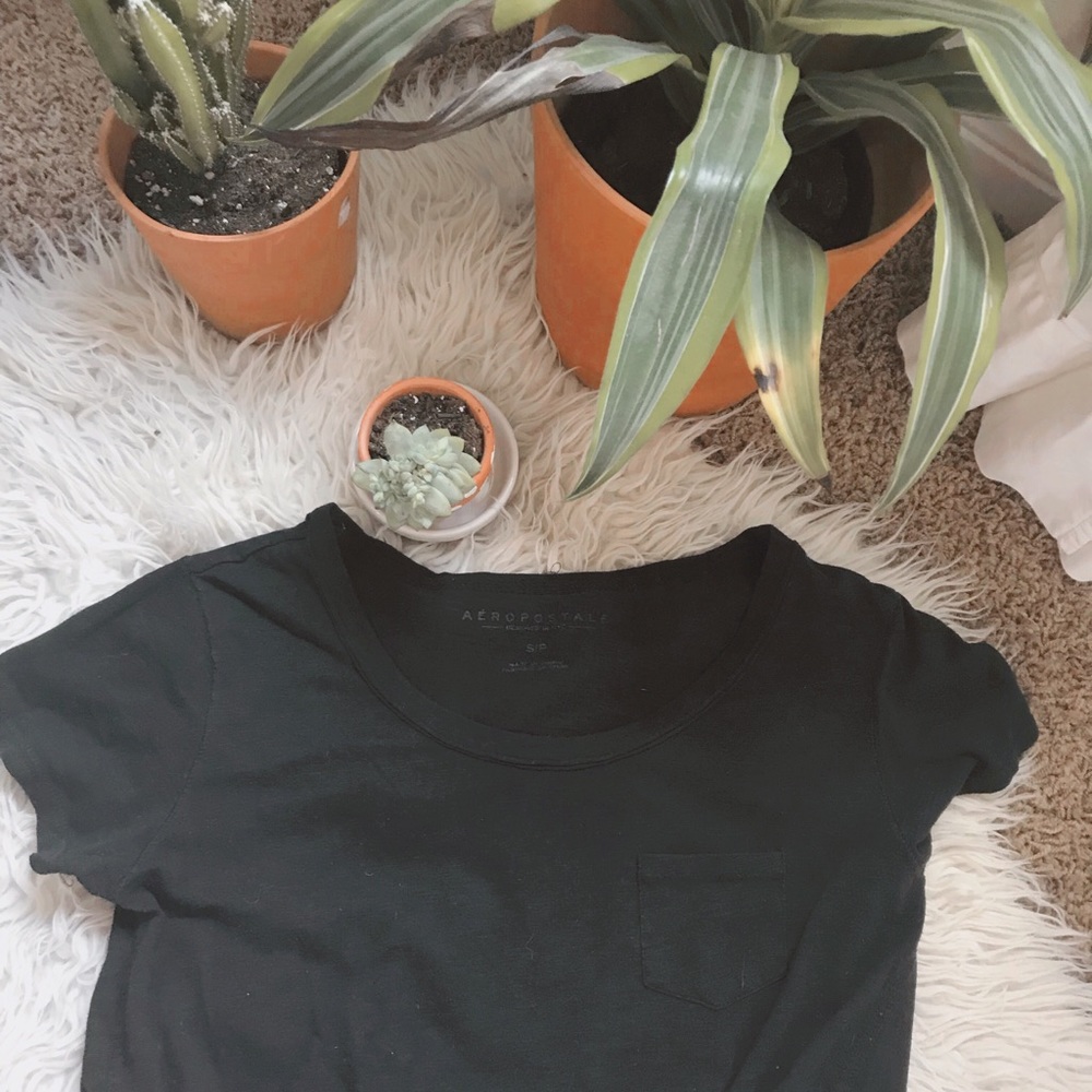 Black shirt sleeve pocket T